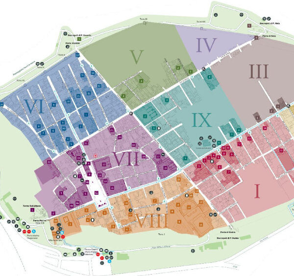 Plan détaillé des ruines de Pompéi divisé en neuf régions numérotées et colorées.