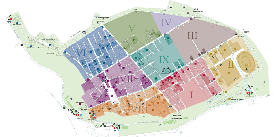 Plan détaillé des ruines de Pompéi divisé en neuf régions numérotées et colorées.